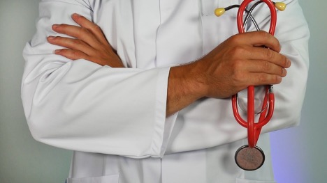 Doctor with arms folded and holding stethoscope